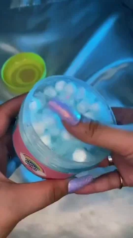 Colorful slime being stretched between hands